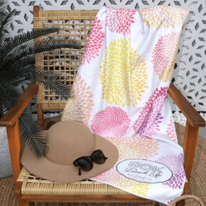 coral daze sand free beach towel over chair