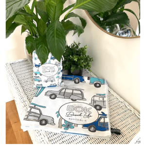 folded cruisin' the coast towel showing car and surfboard design