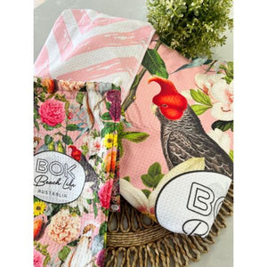 flora shores towel with storage pouch and showing front and reverse designs