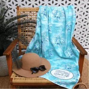 Turtle Cay Sand Free Beach Towel draped over chair